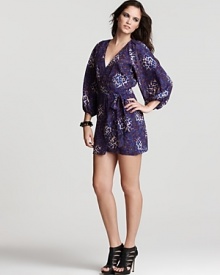 Take a walk on the wild side of style in Parker's leopard print mini dress. The long sleeve style is pleated at the waist and alluring with towering, strappy stilettos. Take a walk on the wild side of style in Parker's leopard print mini dress. The long sleeve style is pleated at the waist and alluring with towering, strappy stilettos.