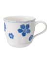 Vintage charm meets modern durability in the Farmhouse Touch teacup, featuring cornflower-blue florals and bands in delicately embossed porcelain from Villeroy & Boch.