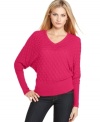 Calvin Klein's petite V-neck sweater features dolman sleeves and a stylish, slightly sheer pattern. Elongated, fitted ribbing at the cuffs and hem accentuates the drape of the silhouette. (Clearance)