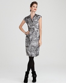 A bold snake print lends exotic flair to this Jones New York Collection dress, designed in an ultra-flattering faux wrap silhouette. Toughen it up with slouchy boots for downtown cocktails. A bold snake print lends exotic flair to this Jones New York Collection dress, designed in an ultra-flattering faux wrap silhouette. Toughen it up with slouchy boots for downtown cocktails.