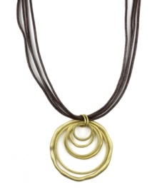 Let your sense of style come full circle. Jones New York's versatile pendant features graduated circles strung on a four-strand leather cord. Pendant and clasp crafted in gold tone mixed metal. Approximate length: 18 inches. Approximate drop: 2-1/2 inches. Let your sense of style come full circle. Jones New York's versatile pendant features graduated circles strung on a four-strand leather cord. Pendant and clasp crafted in gold tone mixed metal. Approximate length: 18 inches. Approximate drop: 2-1/2 inches.