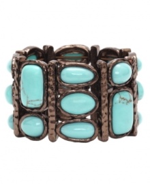 Shift into neutrals. Monet's stunning stretch bracelet combines a rich bronze tone mixed metal setting with bright reconstituted turquoise stones. Bracelet stretches to fit wrist. Approximate diameter: 2-1/4 inches. Shift into neutrals. Monet's stunning stretch bracelet combines a rich bronze tone mixed metal setting with bright reconstituted turquoise stones. Bracelet stretches to fit wrist. Approximate diameter: 2-1/4 inches.