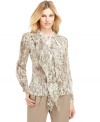 Make a statement in this chic blouse from Jones New York, featuring on-trend animal print and a feminine ruffle at the front.