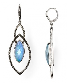 In sterling silver with interlaced loops, Judith Jack's crystal-rimmd hoops make a case for statement sparkle. A must have to add a ravishing pop of color to your evening ensemble. In sterling silver with interlaced loops, Judith Jack's crystal-rimmd hoops make a case for statement sparkle. A must have to add a ravishing pop of color to your evening ensemble.