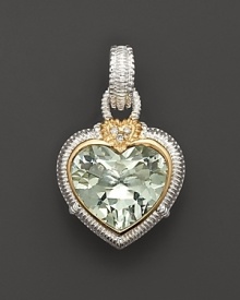 Faceted peridot crystal heart is framed in 18 Kt. gold and sterling silver; with diamond accents. Chain sold separately. Designed by Judith Ripka Faceted peridot crystal heart is framed in 18 Kt. gold and sterling silver; with diamond accents. Chain sold separately. Designed by Judith Ripka