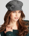 Not quite borrowed from the boys, August Accessories' conductor-style hat is adorned with a scrunchy side bow.
