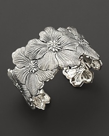 Delicate gardenias, captured at the height of their beauty in sterling silver, overlap on this shining cuff from Buccellati. Delicate gardenias, captured at the height of their beauty in sterling silver, overlap on this shining cuff from Buccellati.