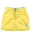 An embroidered Big Pony gives a heritage look to a brightly hued swim trunk in soft, lightweight woven cotton.