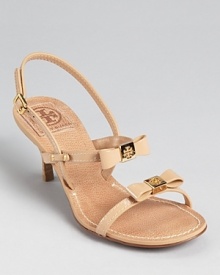 Ladylike bows add a delicate touch to the Tory Burch Kailey sandals, offering a dressed up look that's comfortable with a 2.5 heel. Ladylike bows add a delicate touch to the Tory Burch Kailey sandals, offering a dressed up look that's comfortable with a 2.5 heel.