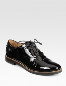 A menswear-inspired silhouette in patent leather with charming laces. Stacked heel, 1 (25mm)Patent leather upperLeather liningRubber solePadded insoleMade in Italy A menswear-inspired silhouette in patent leather with charming laces. Stacked heel, 1 (25mm)Patent leather upperLeather liningRubber solePadded insoleMade in Italy