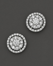 Diamond flower stud earrings framed in diamond pavé, set in 14 Kt. white gold. Diamond flower stud earrings framed in diamond pavé, set in 14 Kt. white gold.