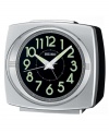 This handsome alarm clock from Seiko will add charm to your nightstand with its chic, refined retro aesthetics. Rectangular silvertone mixed metal case. Round black dial with logo, numerical indices, bell alarm with snooze, dual light and luminous hands. Battery included. Measures approximately 4-1/2 x 5 x 2-4/5. One-year limited warranty.
