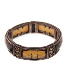 Crafted in copper tone mixed metal with topaz and aurora borealis glass stones, 2028's stretch bracelet will stand out as a suitably stylish accent for your fall wardrobe. Bracelet stretches to fit wrist. Approximate diameter: 2-1/4 inches. Crafted in copper tone mixed metal with topaz and aurora borealis glass stones, 2028's stretch bracelet will stand out as a suitably stylish accent for your fall wardrobe. Bracelet stretches to fit wrist. Approximate diameter: 2-1/4 inches.