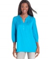 A lace inset at each shoulder and pretty pleating through the chest give this Style&co. petite top fashionable flair.