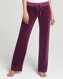 Rendered in plush terry, these Juicy Couture pants celebrate your relaxed style sensibility with an effortless wide-leg silhouette. Rendered in plush terry, these Juicy Couture pants celebrate your relaxed style sensibility with an effortless wide-leg silhouette.