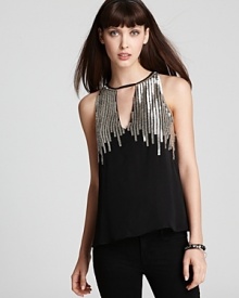 Shine on in this Parker top with sparkling, silver beading. Wear it with sleek leather leggings for a perfect party look! Shine on in this Parker top with sparkling, silver beading. Wear it with sleek leather leggings for a perfect party look!