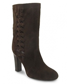 Woven sides add bohemian charm to these ladylike suede boots from Delman. Woven sides add bohemian charm to these ladylike suede boots from Delman.