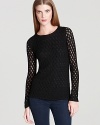 This body-skimming knit top from DIANE von FURSTENBERG works just as well with sleek skinny jeans as it does tucked into a chic pencil skirt.
