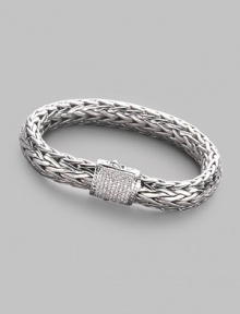 A rich woven chain of sterling silver with a barrel clasp of 18k white gold and pavé diamonds. Diamonds, 0.62 tcw Sterling silver and 18k white gold Length, about 7½ Width, about ¼ Push-lock clasp Made in Bali