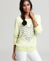 A heart-shaped skeleton makes a quirky statement on this electrically hued WILDFOX sweatshirt.