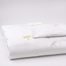 Embroidered dragonflies accented by green borders and trim add a subtle pop of color to a bedroom motif that is at once fanciful and fresh. The bedskirt features a split-corner pleat, embellished with a green trim all around. Embroidered dragonflies accented by green borders and trim add a subtle pop of color to a bedroom motif that is at once fanciful and fresh. The bedskirt features a split-corner pleat, embellished with a green trim all around.