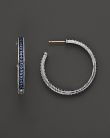 Sparkling sapphires detail a classic pair of sterling silver hoop earrings from Judith Ripka. Sparkling sapphires detail a classic pair of sterling silver hoop earrings from Judith Ripka.