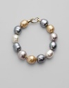 Soft shades come together in a substantial strand of lustrous baroque pearls. 14mm champagne, nuage, grey and white man-made, organic pearls 18k goldplated sterling silver spring clip clasp Length, about 8 Made in Spain