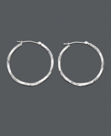 Elegant earrings with a chic twist. The perfect last minute accessory -  hoop earrings crafted in 14k white gold with a unique twisted design. Approximate diameter: 1-1/4 inches.