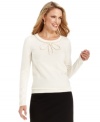 A beaded bow at the neckline of Charter Club's petite sweater is a charming finish to this flattering look.