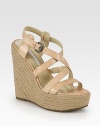 Elevated espadrille wedge with adjustable leather criss-cross straps and a secure slingback. Hemp-covered wedge, 5½ (140mm)Covered platform, 1½ (40mm)Compares to a 4 heel (100mm)Leather upperLeather liningRubber solePadded insoleImportedOUR FIT MODEL RECOMMENDS ordering true size. 