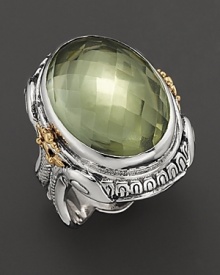 Sterling silver, touched with 14K yellow gold and detailed with a mythological motif, houses a dramatic, faceted green amethyst. Sterling silver, touched with 14K yellow gold and detailed with a mythological motif, houses a dramatic, faceted green amethyst.
