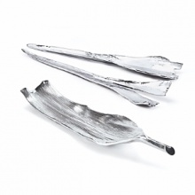 The Botanical collection from Michael Aram takes him back to his core design of basing his objects on items found in nature. The Palm Servers are food safe and cast from palm bark that a palm tree sheds throughout the year. In Polished Aluminum, 21 Long. The Botanical collection from Michael Aram takes him back to his core design of basing his objects on items found in nature. The Palm Servers are food safe and cast from palm bark that a palm tree sheds throughout the year. In Polished Aluminum, 21 Long.