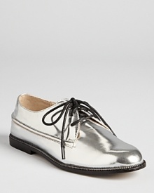 KORS Michael Kors gets edgy with the metallic Cornfield loafers, trimmed in a decorative zipper trim for downtown-cool. KORS Michael Kors gets edgy with the metallic Cornfield loafers, trimmed in a decorative zipper trim for downtown-cool.