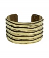Bring heightened style to your day or night look with this ultra-chic cuff from New York City-based accessory label Dannijo - Large size, made of stylishly distressed oxidized brass with cut out striped detailing - Wear with a classic cocktail dress or an on-trend off-duty ensemble