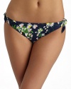 Sunny daisies grow throughout this stretch nylon style with side ties for added charm.Elastic waistband Side ties Fully lined 80% nylon/20% spandex Fully lined Hand wash Made in USA of imported fabricPlease note: Bikini top sold separately. 