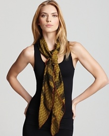 Bubbly, imperfect dots decorate a charming silk scarf from Burberry, pairing with the brand's signature check pattern and a primary hue. Bubbly, imperfect dots decorate a charming silk scarf from Burberry, pairing with the brand's signature check pattern and a primary hue.
