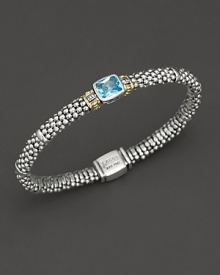 From the Glacier collection, thin caviar rope bracelet with centered blue topaz stone and gold accents. Designed by Lagos. From the Glacier collection, thin caviar rope bracelet with centered blue topaz stone and gold accents. Designed by Lagos.