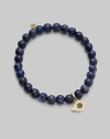 The evil eye, rendered in diamonds and sapphires, makes a graceful amulet, thought to offer protection as it hangs from a stretchy strand of sodalite beads. Diamonds, 0.07 tcw Sapphires Sodalite 14k yellow gold Unstretched diameter, about 2 Imported