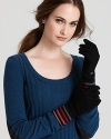 SONIA RYKIEL puts a fun twist on the classic black glove with a cuff full of pink, red and gray stripes.