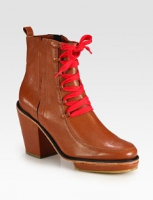 Rustic, richly hued leather boot has a back pull tab, elastic side gores and contrasting laces. Self-covered heel, 3 (75mm)Island platform, 1 (25mm)Compares to a 2 heel (50mm)Leather and elastic upperLeather liningRubber solePadded insoleImported Rustic, richly hued leather boot has a back pull tab, elastic side gores and contrasting laces. Self-covered heel, 3 (75mm)Island platform, 1 (25mm)Compares to a 2 heel (50mm)Leather and elastic upperLeather liningRubber solePadded insoleImported
