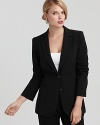 Over sharp button-downs or effortless tees, DKNY's essential black blazer pairs seamlessly with your favorite tops.