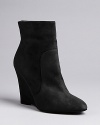 Max Mara strikes the ideal balance between basic and fashion detail in these elegantly crafted wedge booties, with subtle seaming.