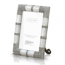 A unique metal frame with precious mother of pearl features a fully studded four corner embellishment with hundreds of handset Swarovski crystals. The back of the frame uses a combination of metal and enamel with large Swarovski studs. A unique metal frame with precious mother of pearl features a fully studded four corner embellishment with hundreds of handset Swarovski crystals. The back of the frame uses a combination of metal and enamel with large Swarovski studs.