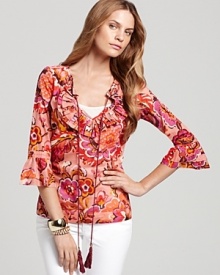 Channel a '70s bohemian spirit in this ruffled Tory Burch silk top by teaming it with the season's best flare jeans and wooden wedges. Channel a '70s bohemian spirit in this ruffled Tory Burch silk top by teaming it with the season's best flare jeans and wooden wedges.