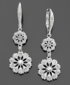 Glorious medallions highlighted by crystals delectably dangle from these gorgeous drop earrings set in silvertone mixed metal. Approximate drop: 1-1/2 inches.