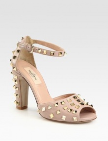 An adjustable ankle strap tops this classic leather silhouette, coated with metal studs for a hint of rocker-edge. Self-covered heel with studs, 3¾ (95mm)Leather upperLeather lining and solePadded insoleMade in ItalyOUR FIT MODEL RECOMMENDS ordering one half size up as this style runs small. An adjustable ankle strap tops this classic leather silhouette, coated with metal studs for a hint of rocker-edge. Self-covered heel with studs, 3¾ (95mm)Leather upperLeather lining and solePadded insoleMade in ItalyOUR FIT MODEL RECOMMENDS ordering one half size up as this style runs small.