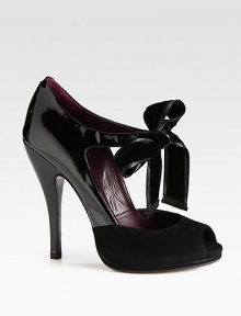 A large velvet bow with ribbon trim defines this suede and patent leather peep toe pump. Patent leather heel, 5 (125mm)Suede-covered platform, ½ (15mm)Compares to a 4½ heel (115mm)Patent leather and suede upper with velvet ribbon-trim bowPeep toeSelf tie bowLeather lining and solePadded insoleMade in Italy A large velvet bow with ribbon trim defines this suede and patent leather peep toe pump. Patent leather heel, 5 (125mm)Suede-covered platform, ½ (15mm)Compares to a 4½ heel (115mm)Patent leather and suede upper with velvet ribbon-trim bowPeep toeSelf tie bowLeather lining and solePadded insoleMade in Italy