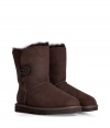 A stylish twist on a venerable classic, the Ugg Australia Bailey Button boot is a welcome addition to your cold weather casual wardrobe - Crafted from twin-faced sheepskin and featuring exposed seams, reinforced heel, traction outsole and signature Ugg label - Wooden button and elastic band closure - Fleece-lined for superior warmth and comfort - Traditional mid-calf height - Truly versatile, perfect for pairing with everything from skinny jeans to yoga pants to miniskirts