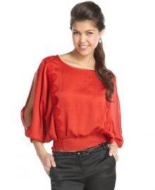 Doll-up your jeans with this XOXO blouson top that features skin-flaunting split sleeves and a cool scallop design! Doll-up your jeans with this XOXO blouson top that features skin-flaunting split sleeves and a cool scallop design!