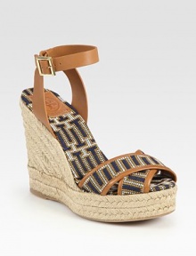 Uptown-chic espadrille silhouette has an adjustable leather ankle strap and soft straps in a modern geometric pattern. Braided hemp wedge, 5 (125mm)Braided hemp platform, 1 (25mm)Compares to a 4 heel (100mm)Leather and fabric upperRubber solePadded insoleImportedOUR FIT MODEL RECOMMENDS ordering true whole size; ½ sizes should order the next whole size up. 